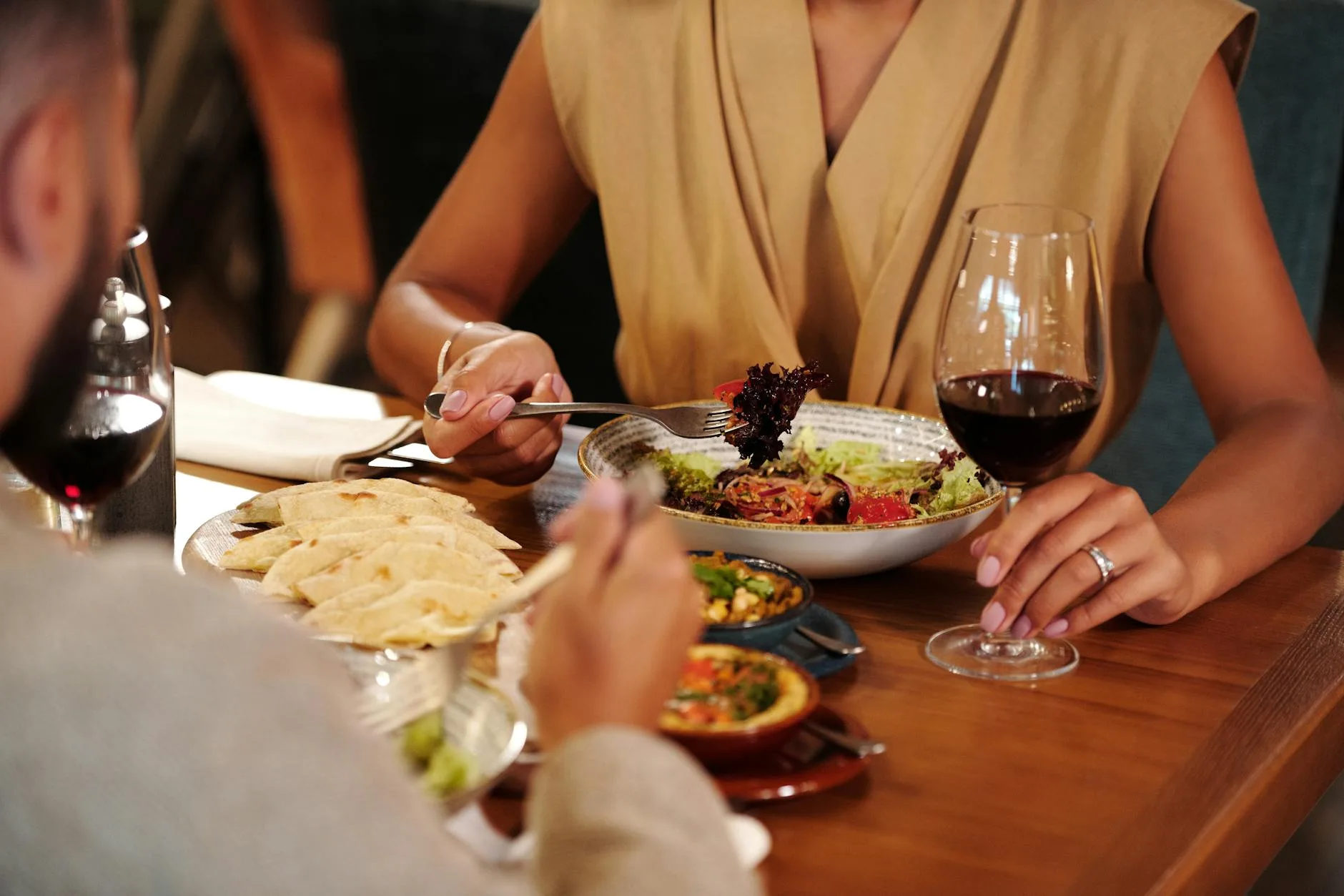 Couple enjoying a romantic dinner — what a well-matched introduction from a professional dating service looks like