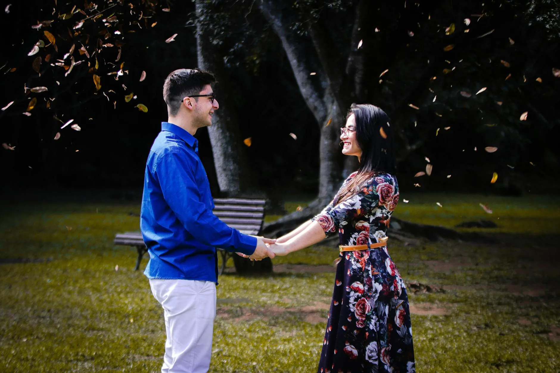 Couple holding hands in an autumn park — the lasting relationships New York City matchmakers help their clients build